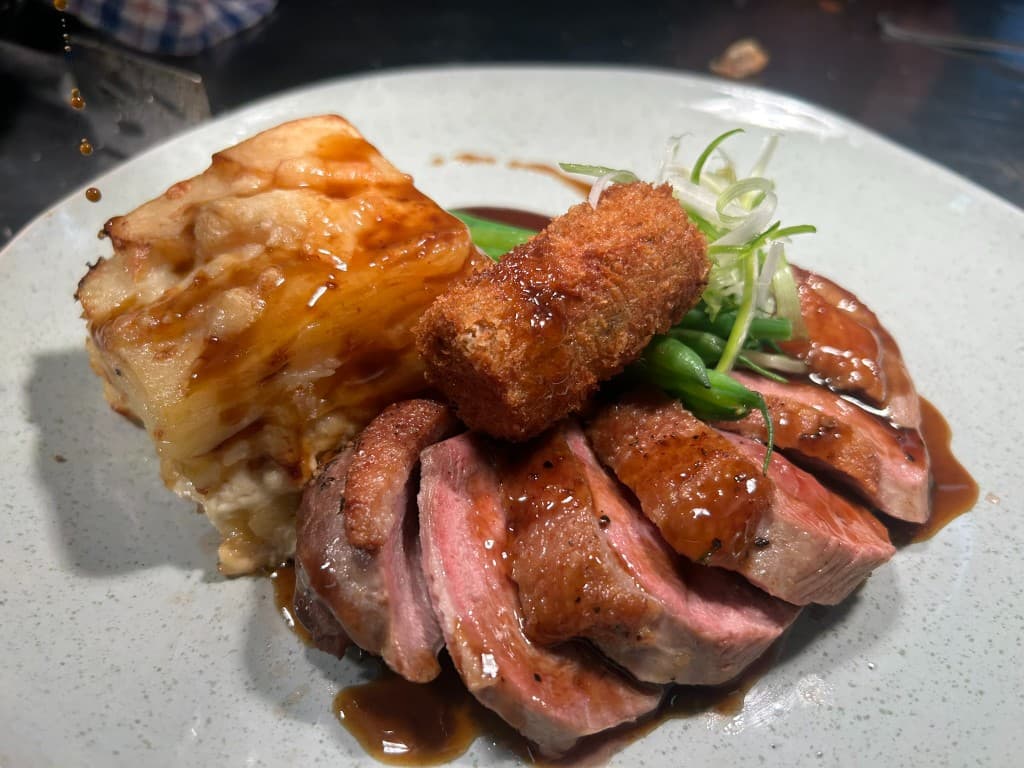 Sliced roast with potato gratin and greens at The Eight Bells